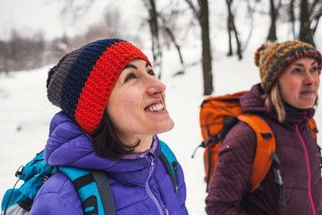 two girls go on a hike in winter