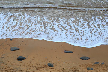 Beach on the Jurassic Coast near village of Charmouth famous by fossils