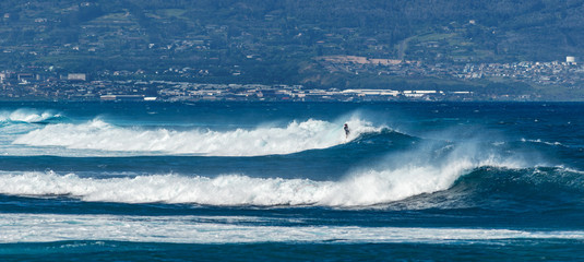 MAUI, HAWAII, USA - DECEMBER 10, 2013: Surfers are riding waves at hookipa beach