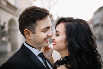 Bride and groom walking through the old town
