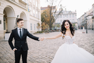 Portrait of a romantic beautiful couple traveler walking in the 