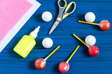 Making Easter bunny from lollipop. Step 1