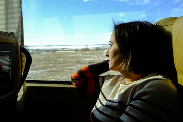 Woman travelling in a comfortable bus