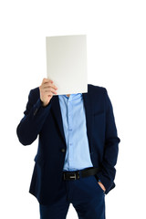 Handsome businessman in stylish suit holding empty sheet of paper instead of his face, isolated on white background