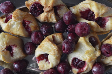 Delicious, shortbread cookies bows with frozen cherries