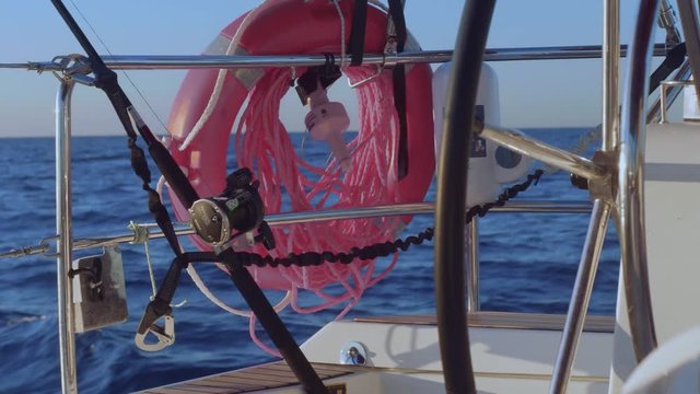 View of life saver, drift signal and spinning for fish trolling on yacht