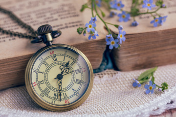 The pocket watch and old book