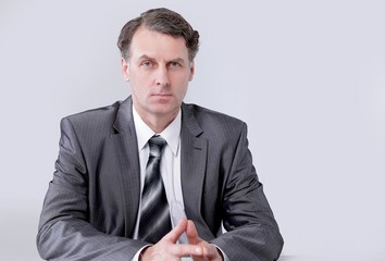 Portrait of businessman sitting at the desk