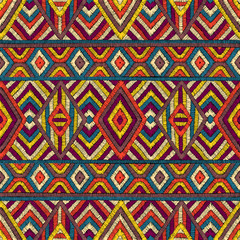 Embroidered seamless geometric pattern. Ornament for the carpet. Ethnic and tribal motifs. Colorful print of handmade. Vector illustration.