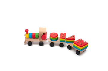 wooden toy children sorter with small wooden details in the form of geometric shapes
