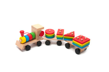 Obraz premium wooden toy children sorter with small wooden details in the form of geometric shapes
