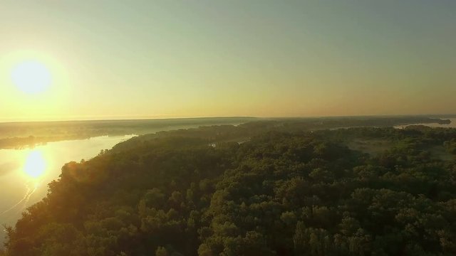 aerial view of river at sunrise 4K, forest and river in morning mist, Very high view of the river forest at sunrise, Aerial view of mystical river at sunrise with fog