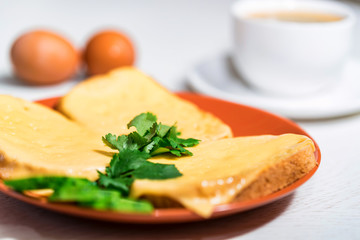Breakfast of cheese sandwich, eggs and coffee