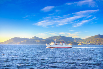 Elba island morning view and ferry boat. Mediterranean sea. Italy