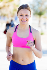 Fototapeta premium Woman practicing jogging for warm-up body