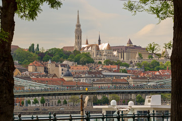 Tiled roofs, Matthias Church and Fishermen's Bastion view across Chain bridge, Budapest