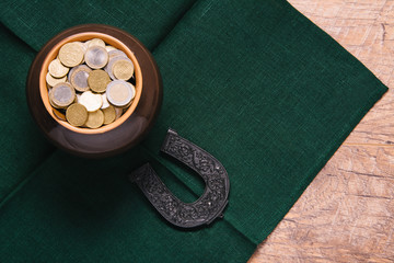 Beautiful green and wooden background for Saint Patric's day celebration. Leprechaun pot of gold....