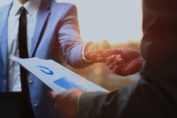 businessman giving a pen. signing of a contract.