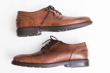 brown leather shoes insulated in white background