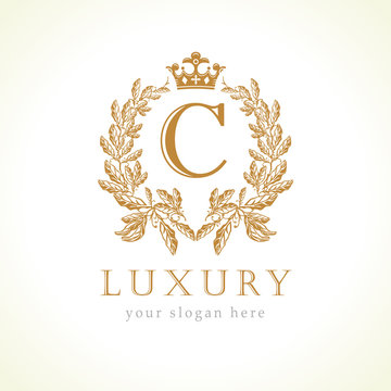 Luxury C letter and crown monogram logo. Laurel elegant beautiful round identity with crown and wreath. Vector letter emblem C for Antique, Restaurant, Cafe, Boutique, Hotel, Heraldic, Jewelry