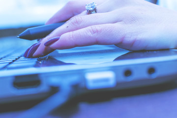 The girl works at the computer. Decorator. Manager. Close up.