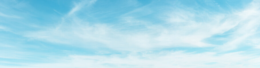Panorama of the sunny sky with small clouds