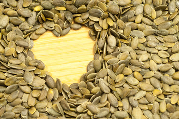 heart of pumpkin seeds on a cutting board