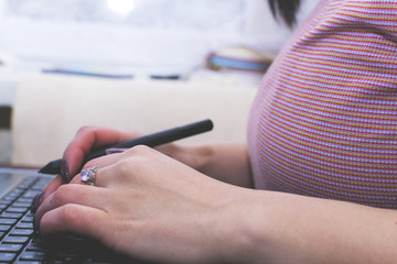 The girl works at the computer. Decorator. Manager. Close up.
