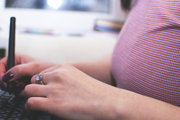 The girl works at the computer. Decorator. Manager. Close up.