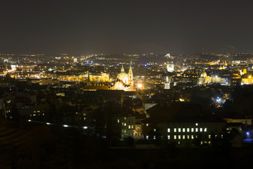 Fototapeta na wymiar Winter night Prague City with St. Nicholas' Cathedral, Czech Republic
