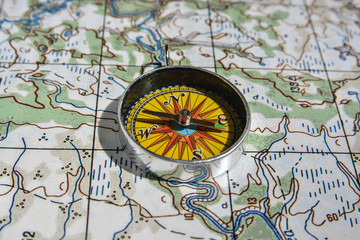 Fototapeta na wymiar Compass on the map.