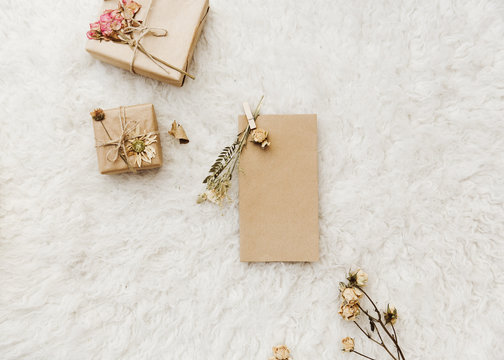 Flat lay mock up with craft card and cozy decorations