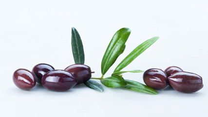 Black Olives with Green Leaves Composition Isolated On White Background