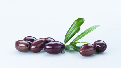 Black Olives with Green Leaves Composition Isolated On White Background