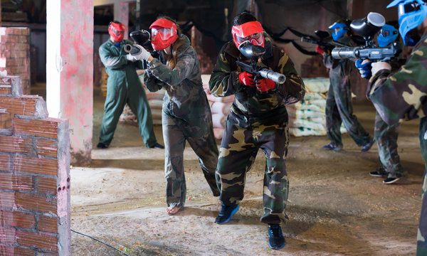 Players in red masks attack rivals