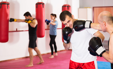 Sportsmen competing in boxing gloves