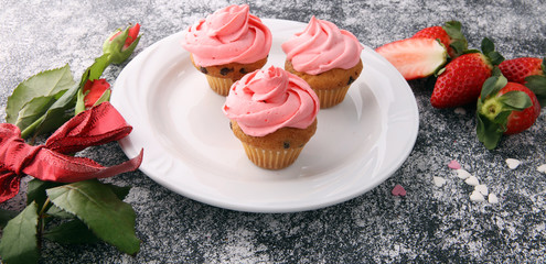 Delicious cupcake for Valentine Day. cake for Valentines day with chocolate and strawberries. Traditional homemade with red roses
