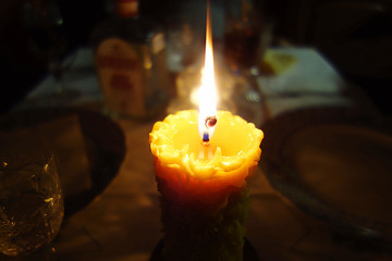 Candle in the still-life of darkness