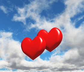 Fototapeta na wymiar Two hearts on a sky background 