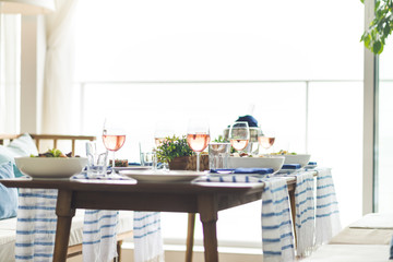 Restaurant table set with glasses, napkins and cutlery