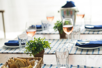 Restaurant table set with glasses, napkins and cutlery
