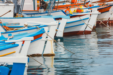 Fototapeta na wymiar Fishing boats in the marina, close up