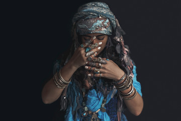 gypsy style young woman wearing tribal jewellery portrait - obrazy, fototapety, plakaty