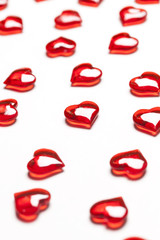 Red love hearts on a plain white background