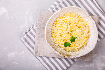Couscous with parsley in the bowl..Concept of Healthy Food.Food or Healthy diet concept.Super Food.Vegetarian.Copy space for Text.