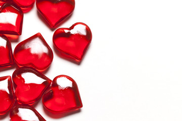 Red love hearts on a plain white background