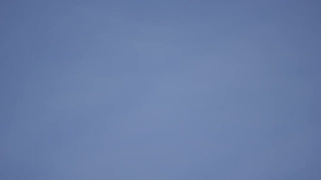 Steam whistle pan away from machinery on blue sky