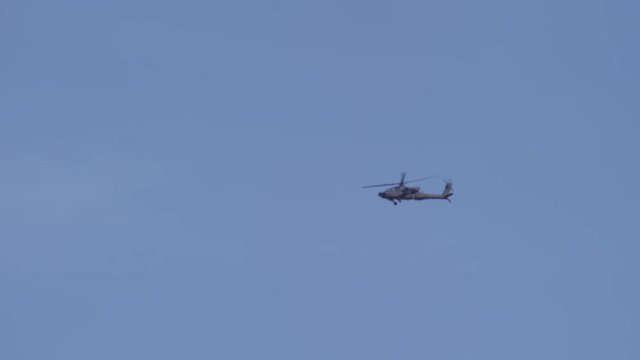 Apache helicopter on blue sky