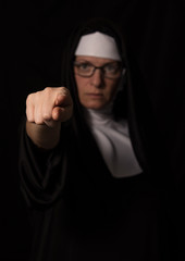 nun pointing finger at you