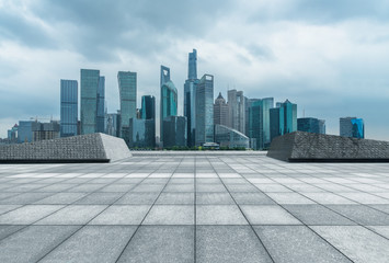 cityscape and skyline of shanghai from empty brick floor.